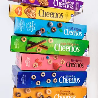 Instagram post featuring stacked boxes of Cheerios for National Cereal Day. - Link to social post