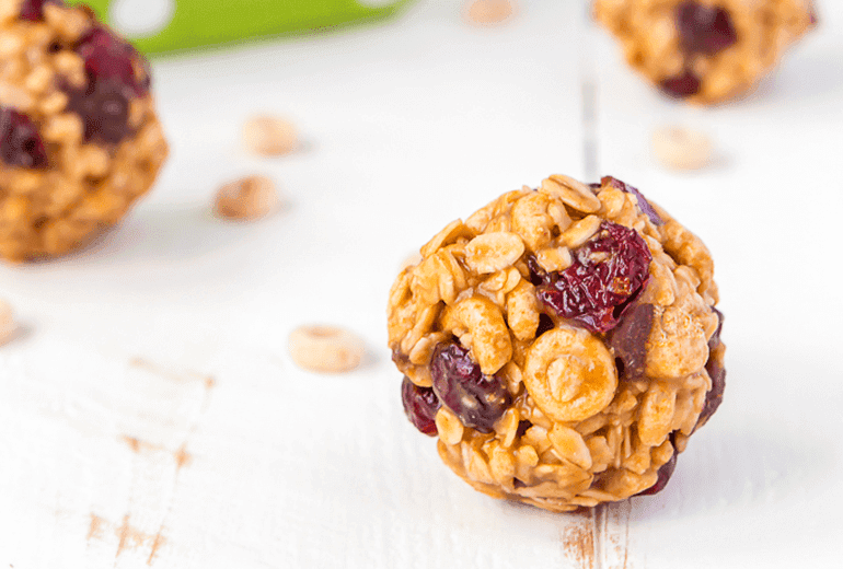 Cheerios cereal, oats, dried cranberries, peanut butter, and maple syrup balls.