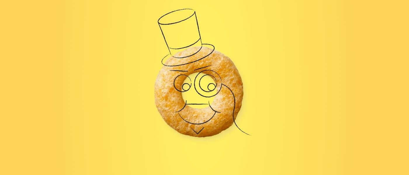 A single Cheerio with a smiling face, top hat, and monocle on a sunny yellow background.